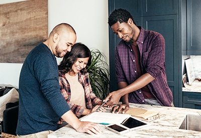 home improvement loans near syracuse ny image of couple looking at documents for project funded by home equity loan