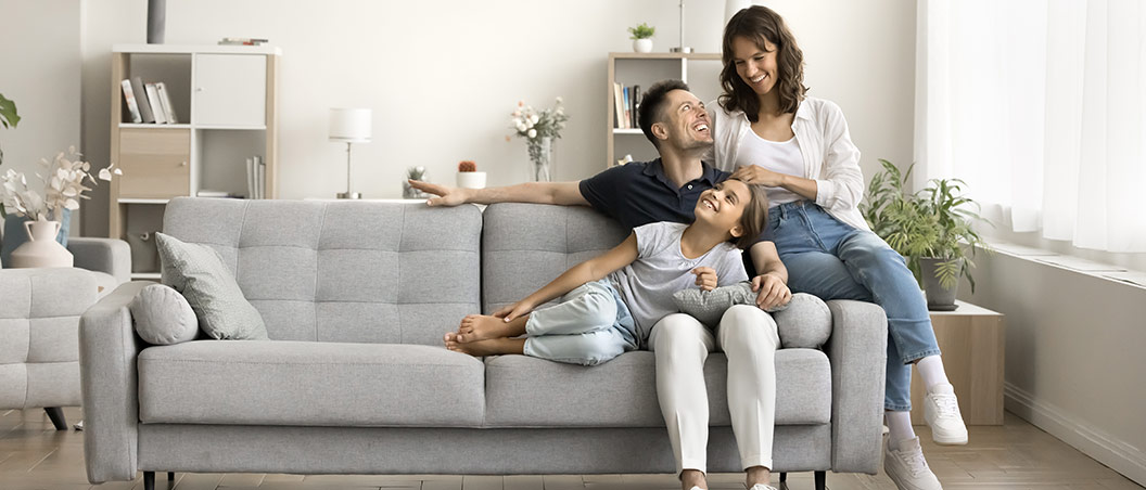 mortgage loans near syracuse ny happy family  lounging in their living room