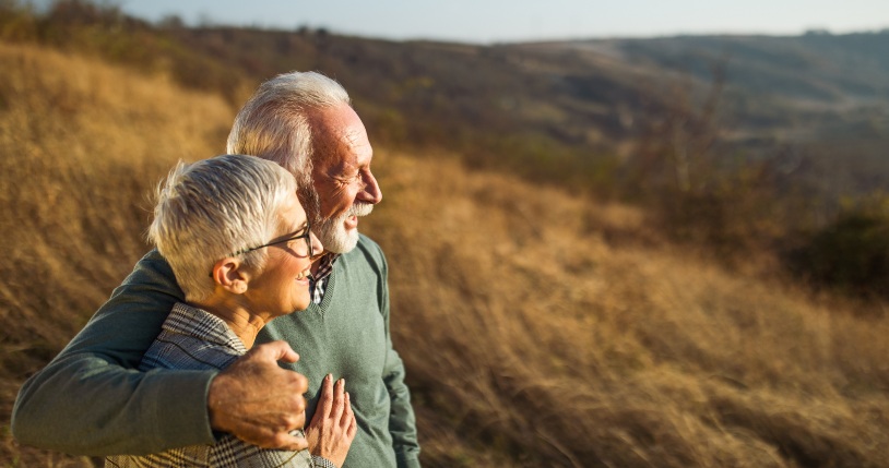 roth ira near manlius ny happy retired couple in field