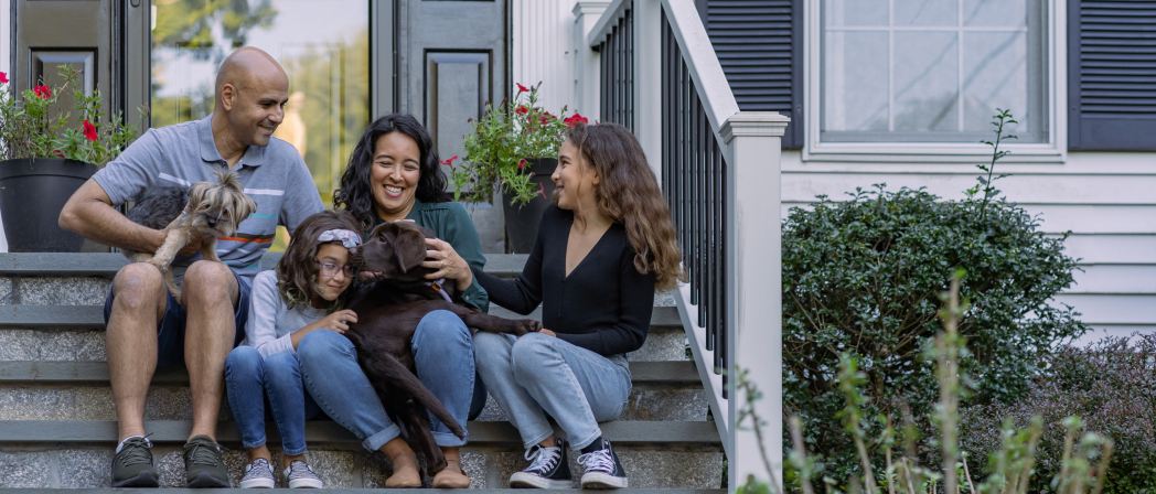 mortgage loans near syracuse ny family sitting on steps