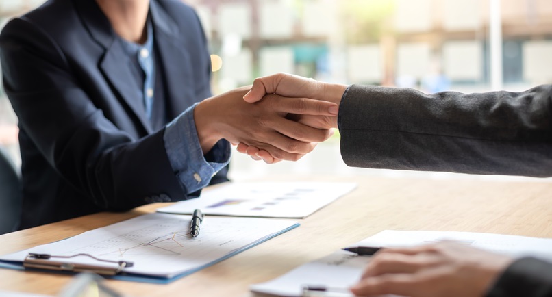 image of people shaking hands after discussing home improvement loan rates near syracuse ny