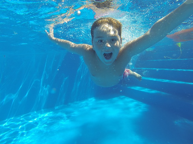 image of child in swimming pool funded by home improvement loans near syracuse ny