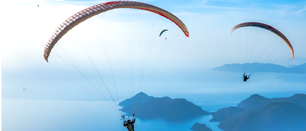 good life adventures program trips and events two people paragliding from geddes federal savings and loan near syracuse ny