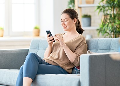 new beginnings image of woman using phone from geddes federal near syracuse ny