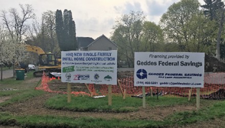 construction loans near syracuse ny image of construction site and signs for hhq new single family infill home construction financing provided by geddes federal savings and loan association